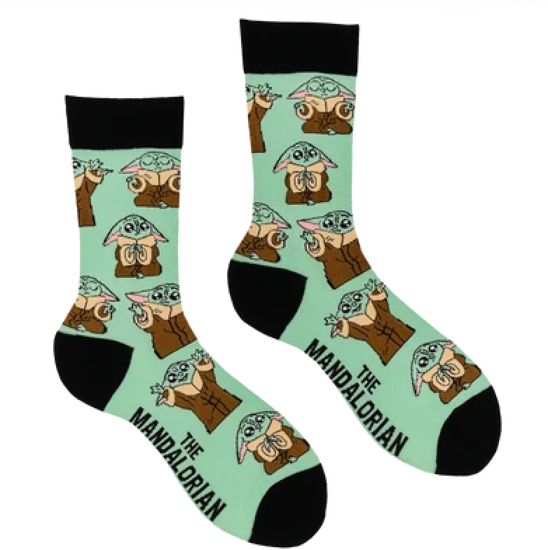 A pair of crew socks with a repeating print of Grogu (The Child) in a mint green background, featuring black heels, toes, and cuffs, with 'THE MANDALORIAN' text printed on one sock.