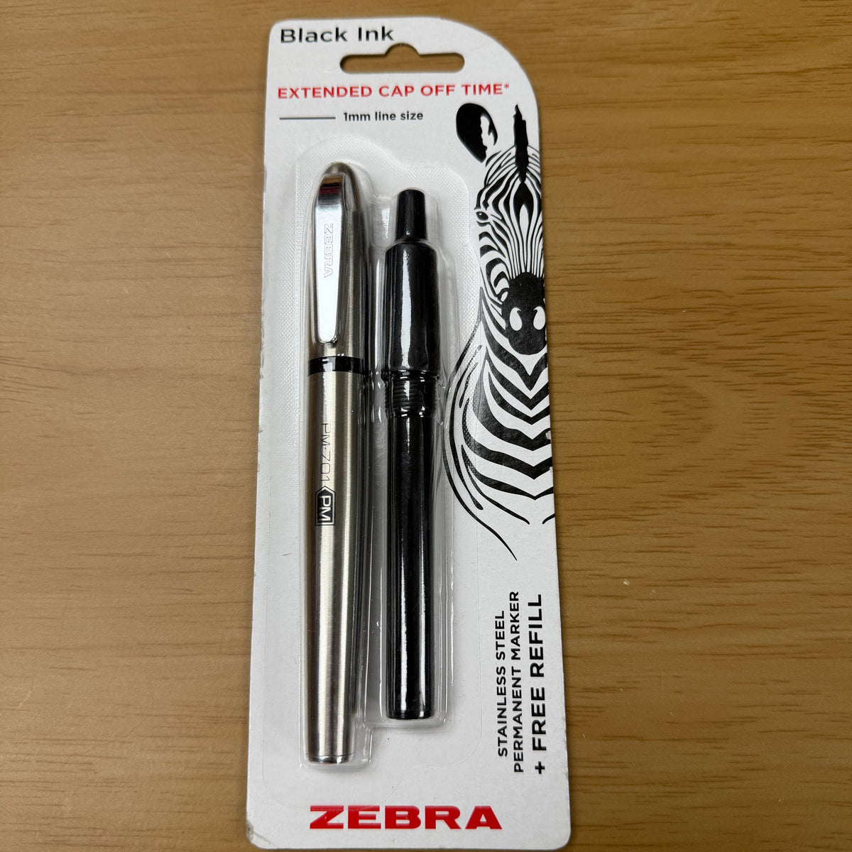 Fine permanent marker, with free refill.