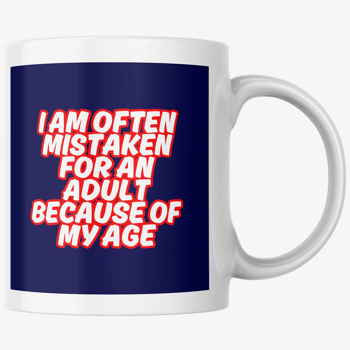 A white ceramic mug with a dark blue printed graphic on the front. The graphic features the text 'I AM OFTEN MISTAKEN FOR AN ADULT BECAUSE OF MY AGE' in bold white letters outlined in red.
