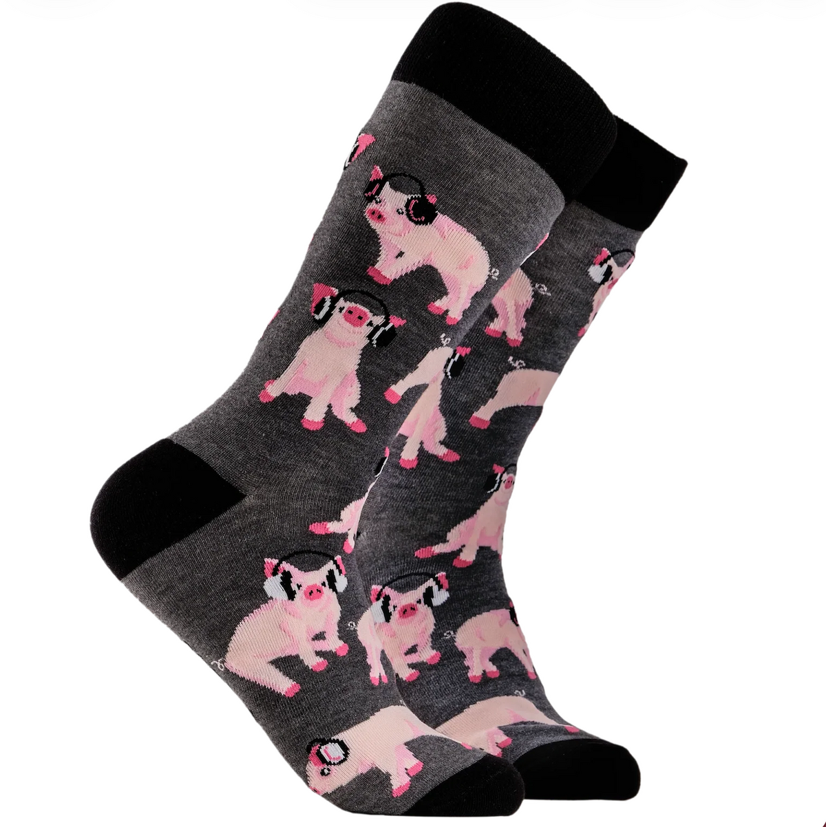 A pair of crew socks in dark grey with a pattern of pink pigs wearing black headphones, finished with solid black heels, toes, and cuffs.