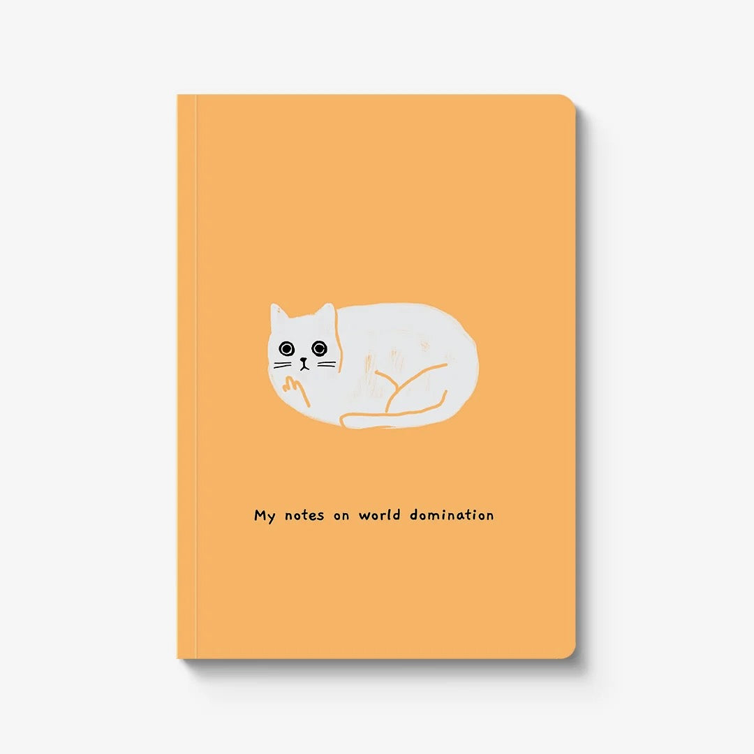 A yellow notebook with a comical llustration of a white cat showing the middle finger with the words 'My notes on world domination' in black.