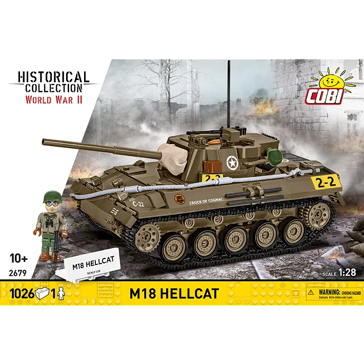 The retail box for the model, showing a picture of the assembled tank on a blurred background of a battle. The manufacturer’s logo is displayed in the top right corner. The HISTORICAL COLLECTION branding is displayed on a white diagonal section on the left, and a yellow strip across the bottom of the box displays the number of pieces, specific name of the tank, its scale, and small warning label. Its name plaque and model soldier stand next to it.