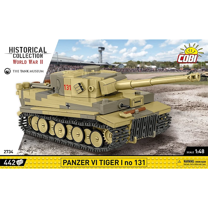 The retail box for the model, showing a picture of the assembled tank on a blurred background of a military base. The manufacturer’s logo is displayed in the top right corner. The HISTORICAL COLLECTION branding and the logo of THE TANK MUSEUM are displayed on a white diagonal section on the left, and a yellow strip across the bottom of the box displays the number of pieces, specific name of the tank, its scale, and small warning label.