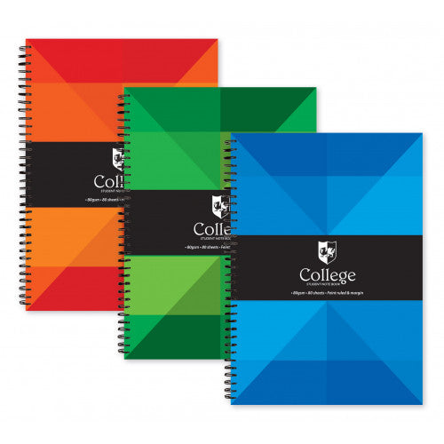 Three spiral-bound notebooks with geometric colour-block covers in red, green and blue, arranged in a fan layout on a white background.