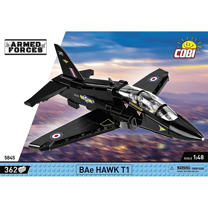 The retail box for the model, showing a picture of the assembled aircraft on a blurred background a city and the sky, creating the implication that the aircraft is flying quickly through the air. The manufacturer’s logo is displayed in the top right corner. The ARMED FORCES branding is displayed on a white diagonal section on the left, and a blue strip across the bottom of the box displays the number of pieces, specific name of the aircraft, scale, and small warning label.