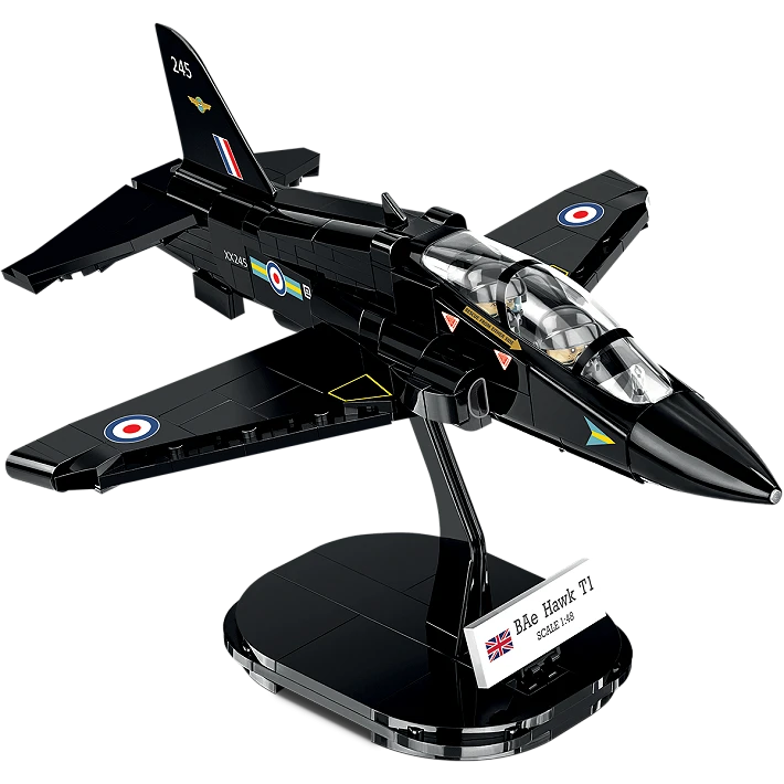 A photo of the assembled model plane, stood on its black display stand. The jet consists of various black blocks, and features a transparent cockpit wind shield. A small white plaque displaying the aircraft’s name and country of origin sits on the display stand. 