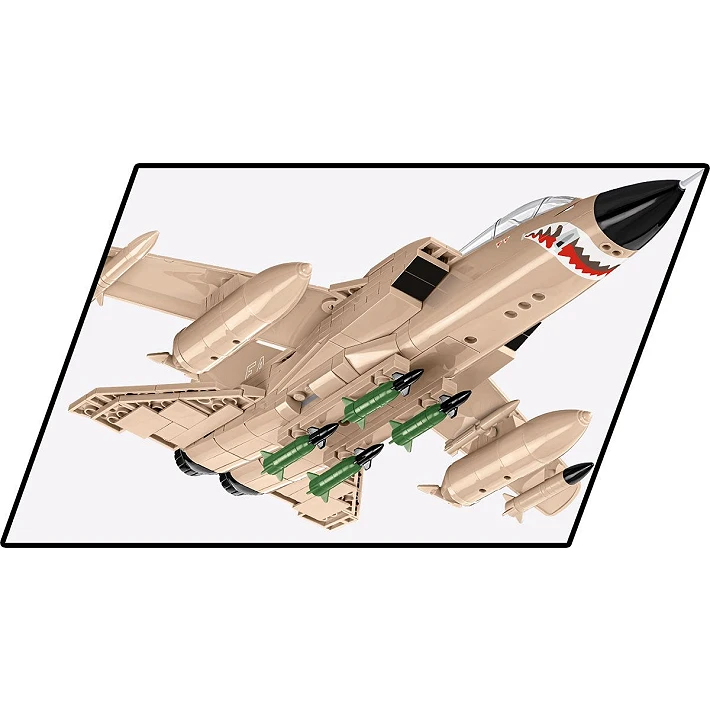 A photo of the underside of the aircraft, showing its bombs and missiles, as well as a painted, pointed-toothed mouth beneath the nose cone.