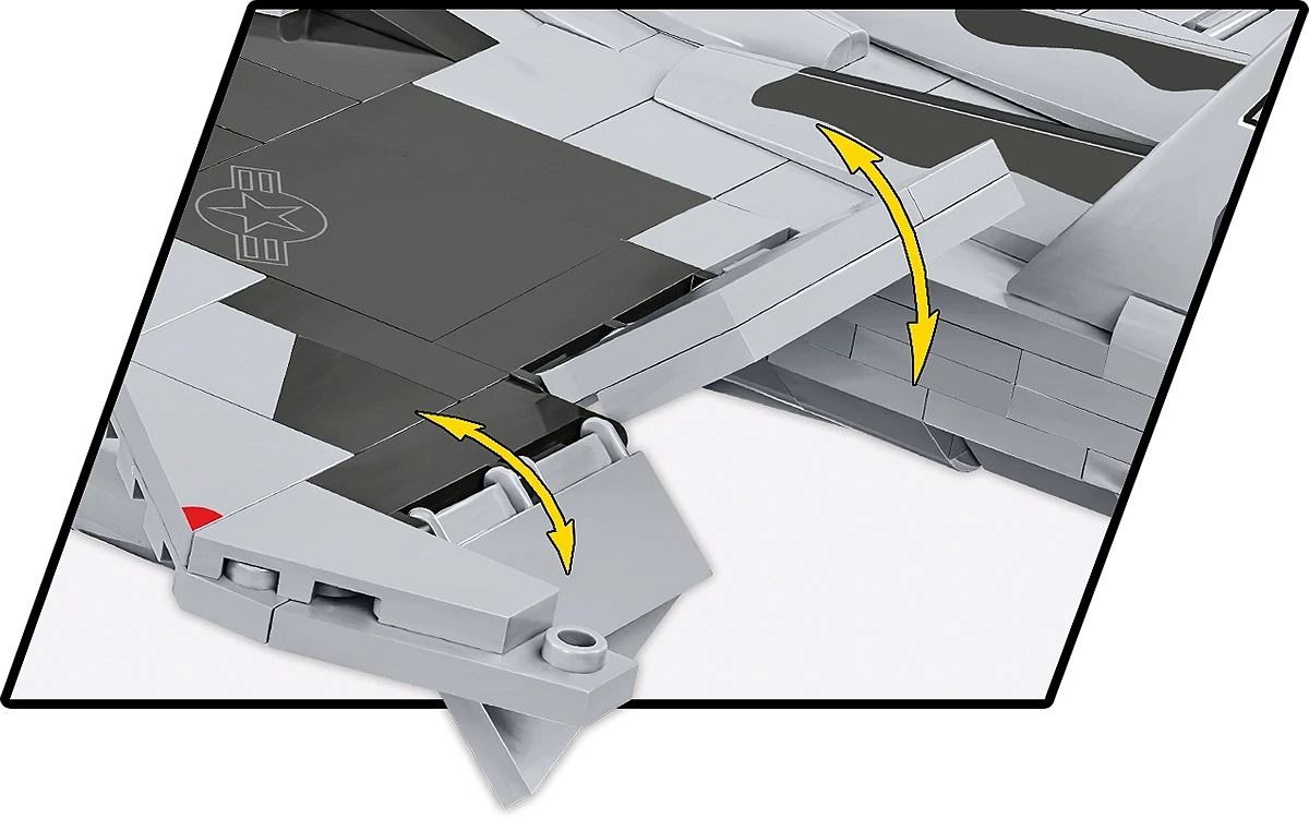 A close-up of the back of the aircraft's wings. The two flaps on the back edge of the wing have double-edged yellow arrows over it, showing that the flaps can be rotated back and forth.