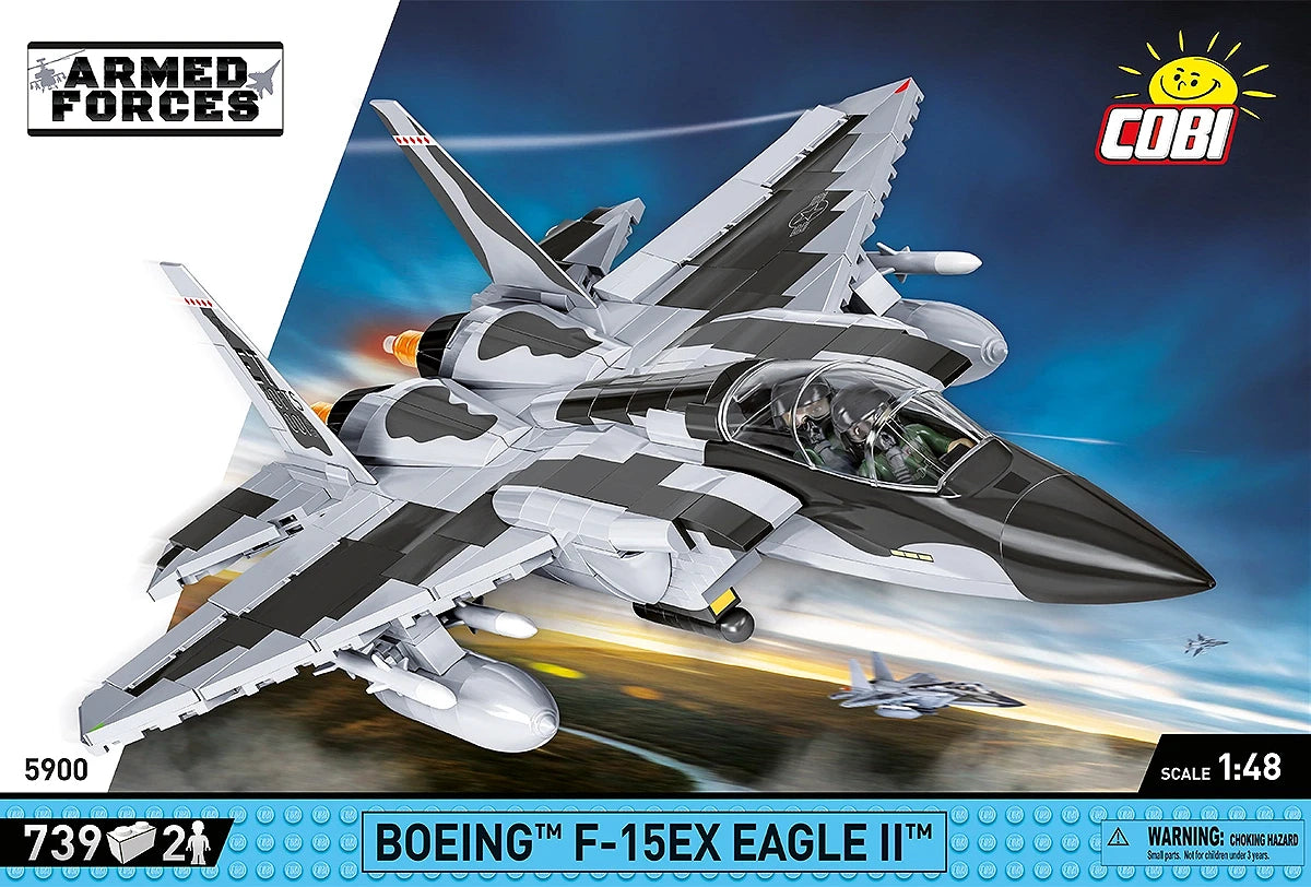 The retail box for the model, showing a picture of the assembled aircraft on a blurred background of the ground and sky, creating the implication that the aircraft is flying quickly through the air. The manufacturer’s logo is displayed in the top right corner. The ARMED FORCES branding is displayed on a white diagonal section on the left, and a blue strip across the bottom of the box displays the number of pieces, specific name of the aircraft, and small warning label. 