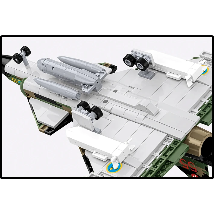 The white underside of the model, showing the detail of the aircraft's landing gears and mounted bombs and weapons