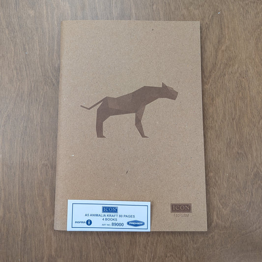 A brown kraft paper notebook cover with a geometric dog illustration, placed on a wooden surface.
