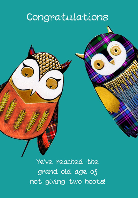 A humorous birthday card featuring a charming illustration of two owls, one in red and gold, the other in purple tartan and gold with the words 'Congratulations' and 'You've reached the grand old age of not giving two hoots' on a teal green background.