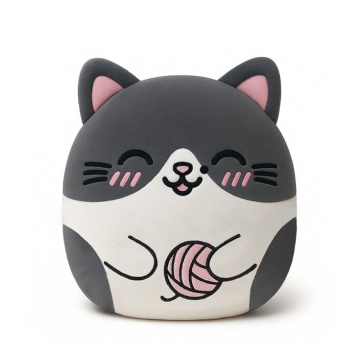 A cute, round, cat-shaped plush toy or cushion featuring a gray and white face with pink inner ears, closed eyes, pink cheeks, and a pink yarn ball on its belly, set against a plain white background.