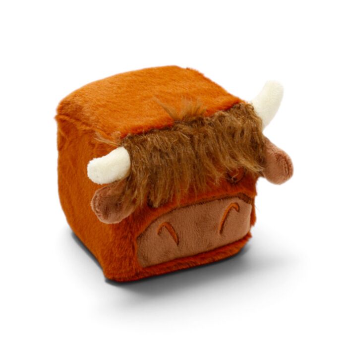 A plush cow cube-shaped squishy toy in orange and brown with white horns, photographed on a clean white background.