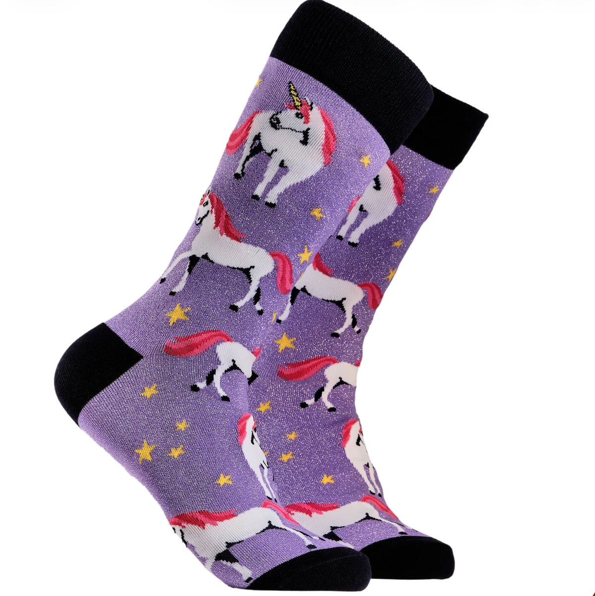 A pair of crew socks with a purple glitter background featuring a repeating pattern of white unicorns with pink mane & tail and yellow stars. The socks have black cuffs, heels, and toes.