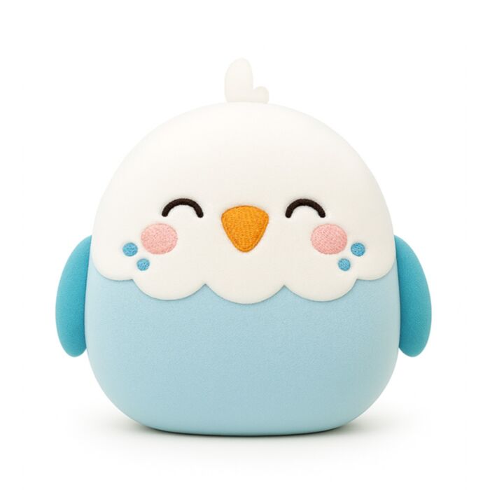A cute, round, budgie plush toy or cushion in light blue and white, featuring embroidered closed eyes, a small orange beak, pink cheeks, and blue accents on a plain white background.
