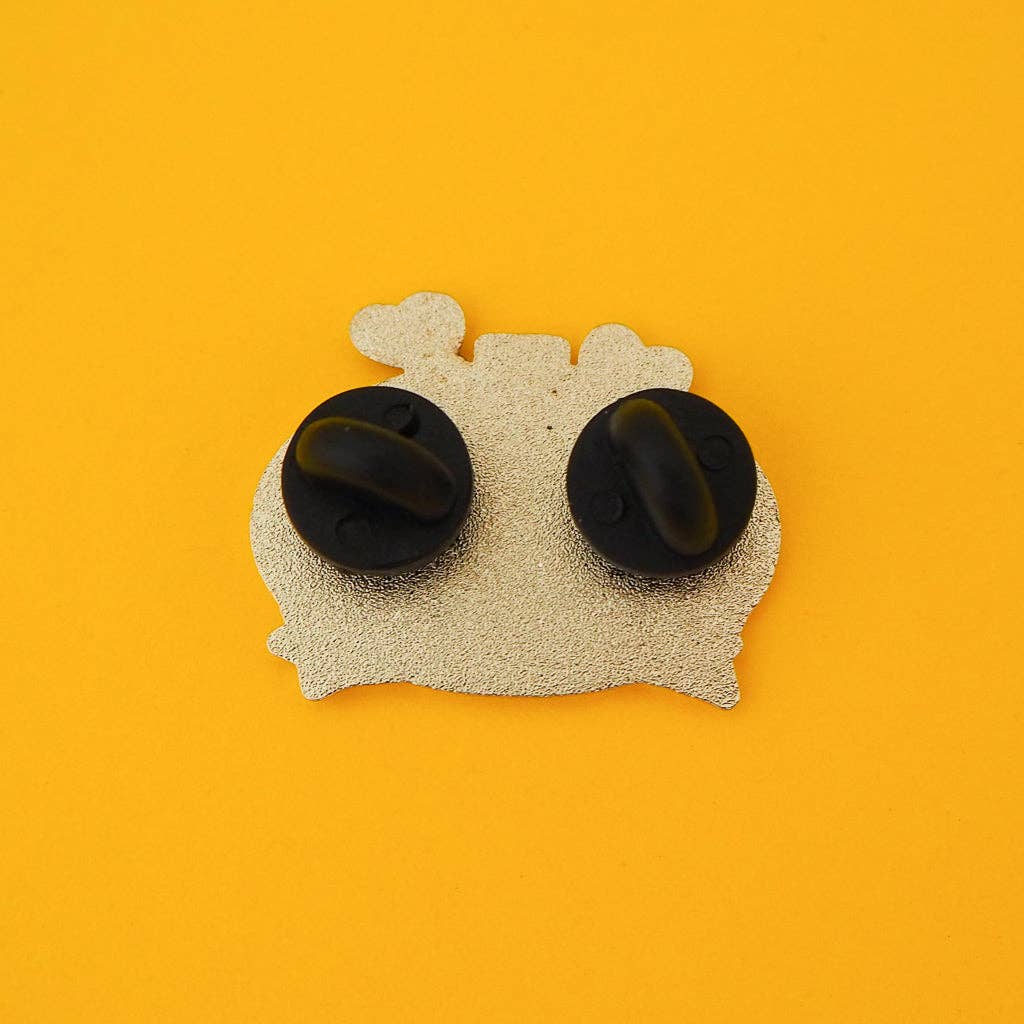 The back of the pin, showing two rubber clutches.