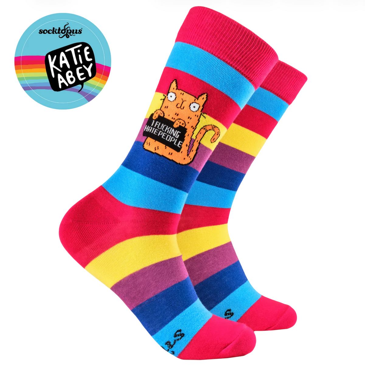 A pair of colourful striped crew socks with a cartoon cat graphic on the front sock. The socks feature bold horizontal stripes in pink, blue, yellow, and purple, with a red toe and heel.